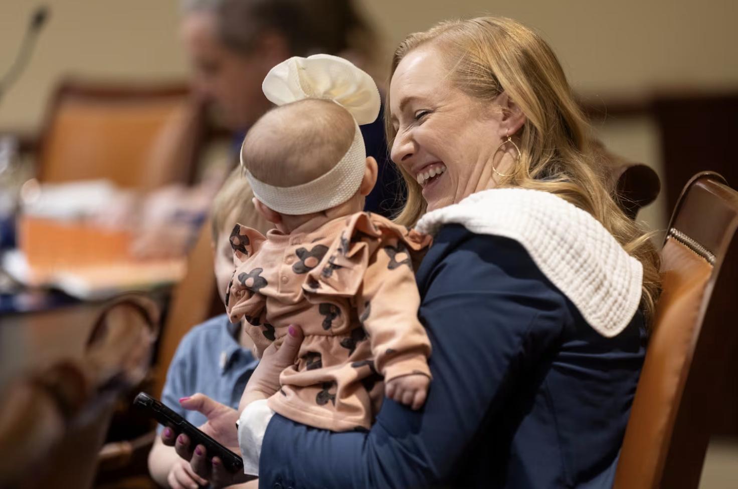 Rep. Candice Pierucci, R-Herriman, sits with her daughter, Quincy, and her son, Benji, after presenting SB230 at the Capitol in Salt Lake City on Monday.