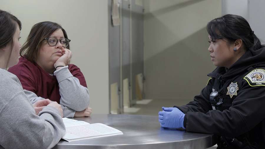Corrections officer Miriniza Fulk interacts with women incarcerated at the Utah State Correctional Facility in January 2024.