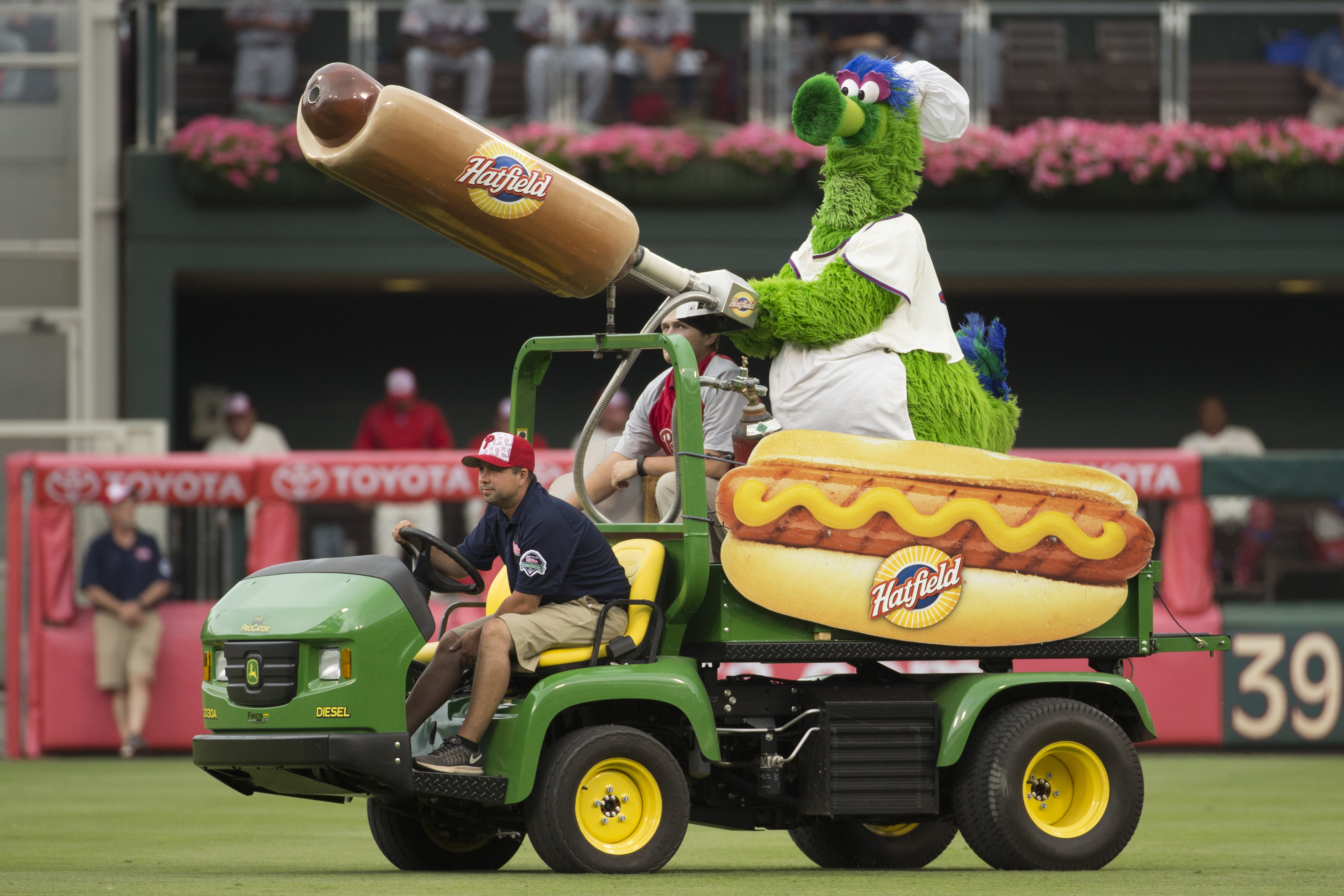 FILE - The Phillie Phanatic comes out with his Hot Dog Launcher during the fifth inning of a baseball game between the Atlanta Braves and the Philadelphia Phillies, Monday, July 4, 2016, in Philadelphia. For more than a quarter-century, Phillies fans thought dollar hot dog night was the best ballpark promotion — but the team has now decided it was the wurst. 