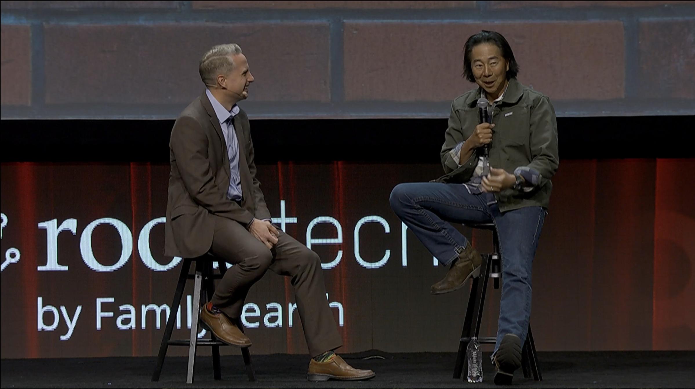Henry Cho speaks with Kirby Heyborne during Cho's keynote address at RootsTech on Thursday.