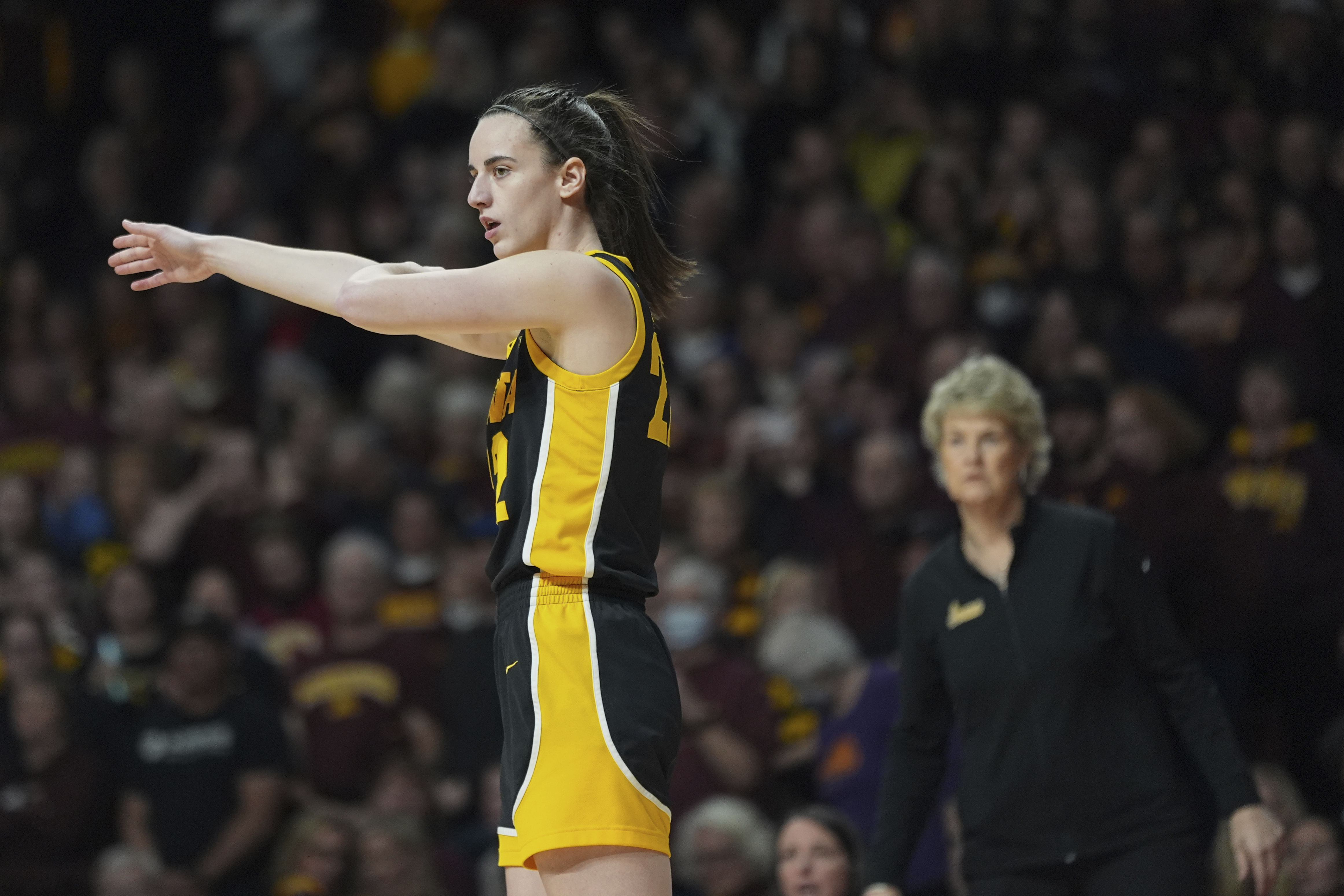 Iowa guard Caitlin Clark, left, gestures during the first half of an NCAA college basketball game against Minnesota, Wednesday, Feb. 28, 2024, in Minneapolis. 