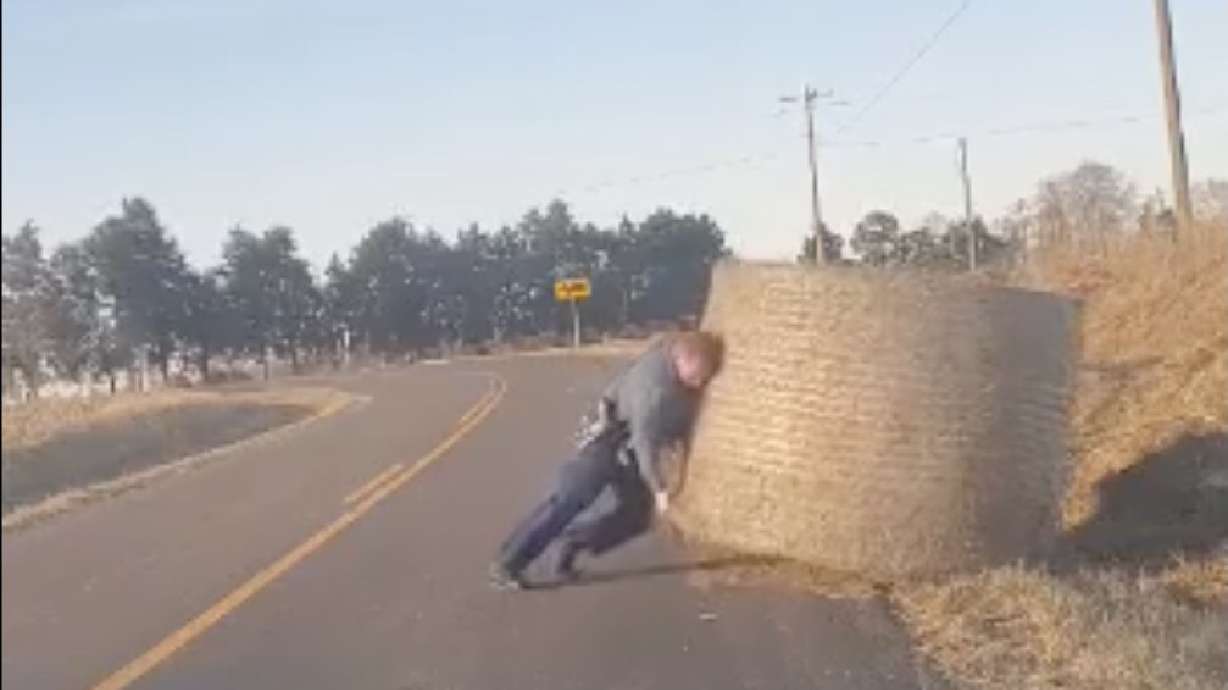 A Missouri State Highway Patrol trooper recently lifted a heavy hay bale that was blocking traffic.