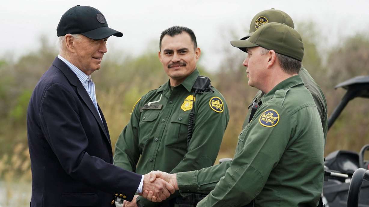 President Joe Biden greets members of the U.S. Border Patrol at the U.S.-Mexico border in Brownsville, Texas, Thursday. Biden and former President Donald Trump heaped blame on each other over migrant crossings ahead of the November election.