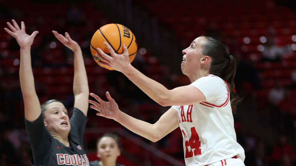 Utah Utes guard Kennady McQueen (24) shoots Washington State Cougars guard Astera Tuhina (11) in Salt Lake City on Thursday, Feb. 29, 2024.