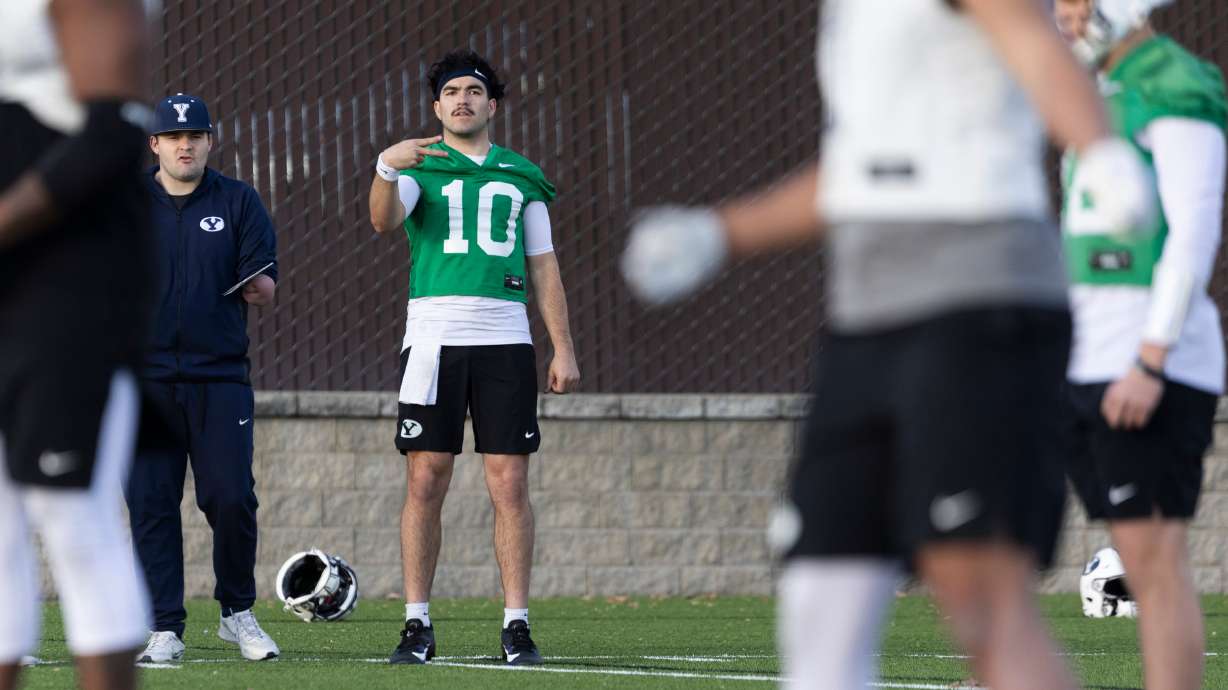 BYU quarterback Treyson Bourguet (10) gestures to his teammates during a practice on the SAB outdoor practice fields at the start of spring camp in Provo on Thursday, Feb. 29, 2024.
