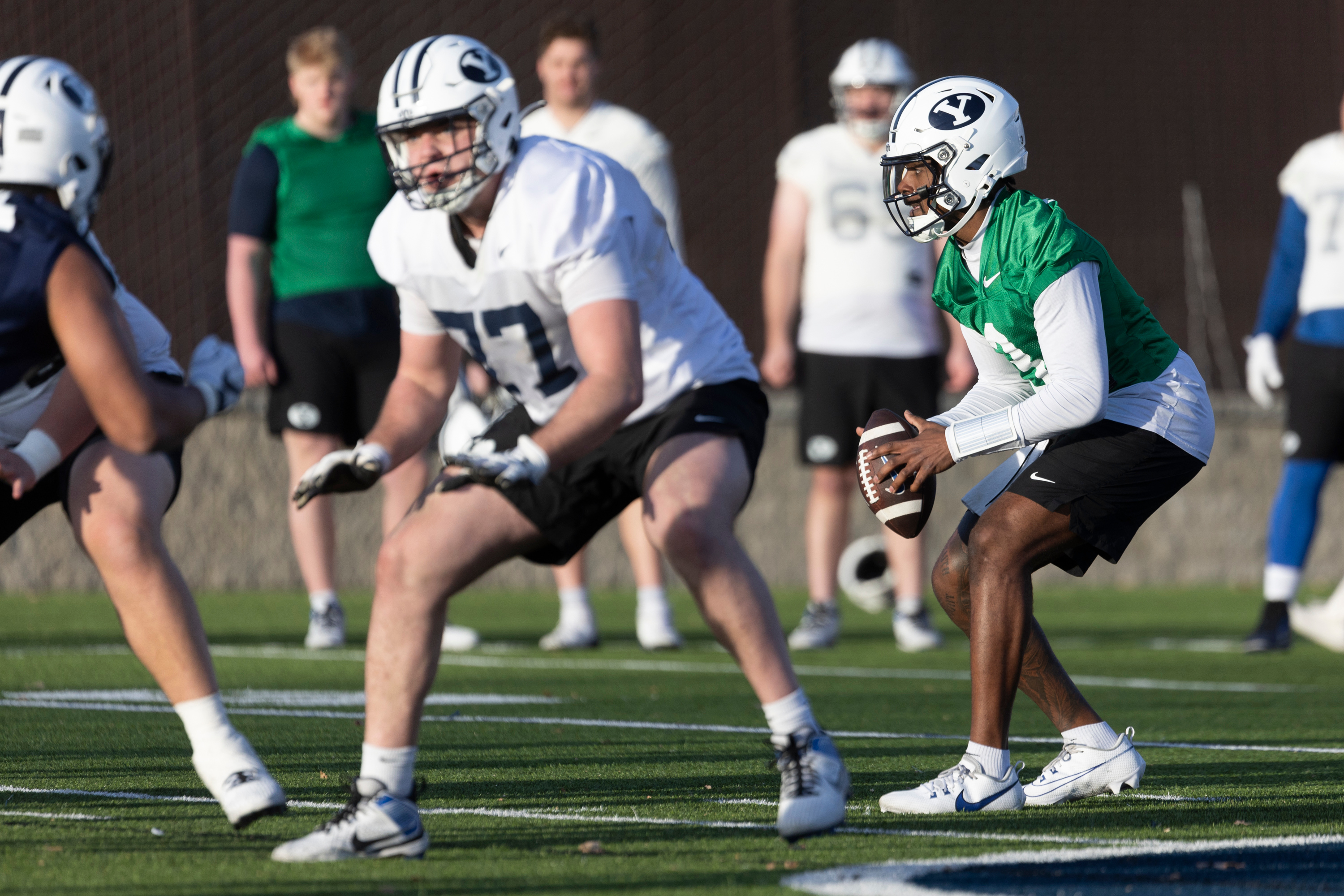 BYU quarterback Gerry Bohanon (3) receives the ball during a practice on the SAB outdoor practice fields at the start of spring camp in Provo on Thursday, Feb. 29, 2024.