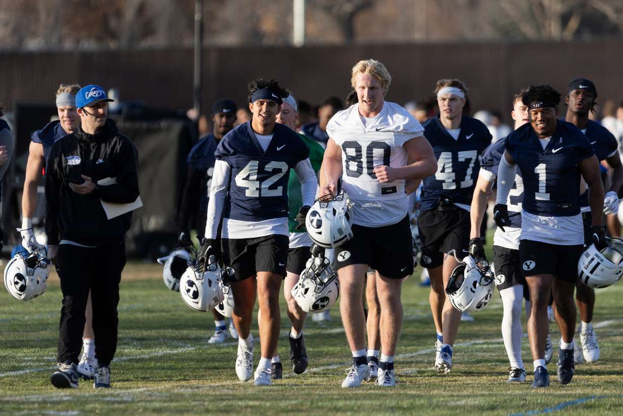 The BYU football team walks off the SAB outdoor practice fields after practice at the start of spring camp in Provo on Thursday, Feb. 29, 2024.