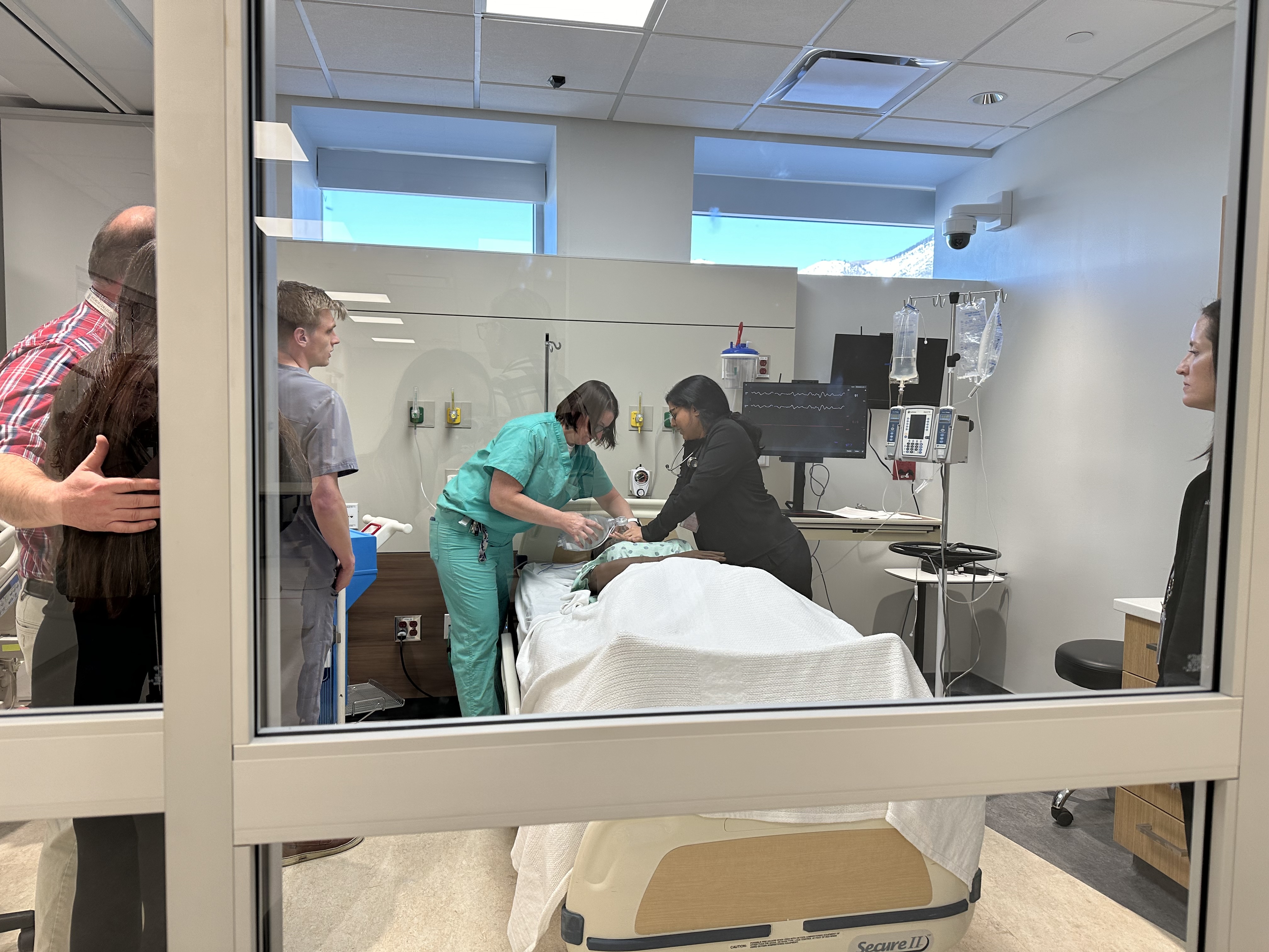 Student doctors practice treating a patient with a heart attack by using a simulator robot at the Noorda College of Osteopathic Medicine in Provo on Feb. 28.