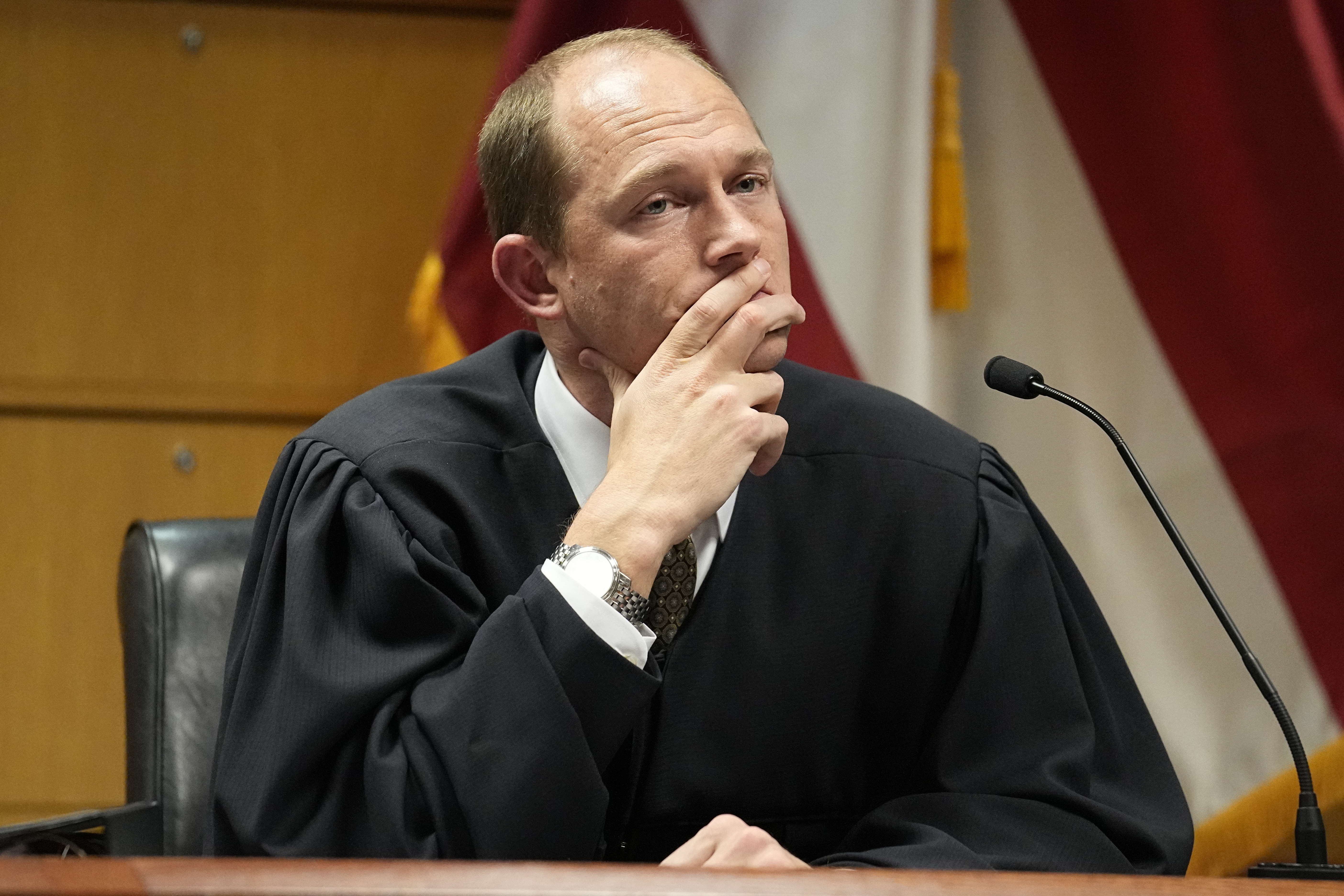 Fulton County Superior Judge Scott McAfee presides in court, Tuesday, in Atlanta. He will hold a final hearing Friday on Donald Trump's bid to disqualify prosecutor Fani Willis.