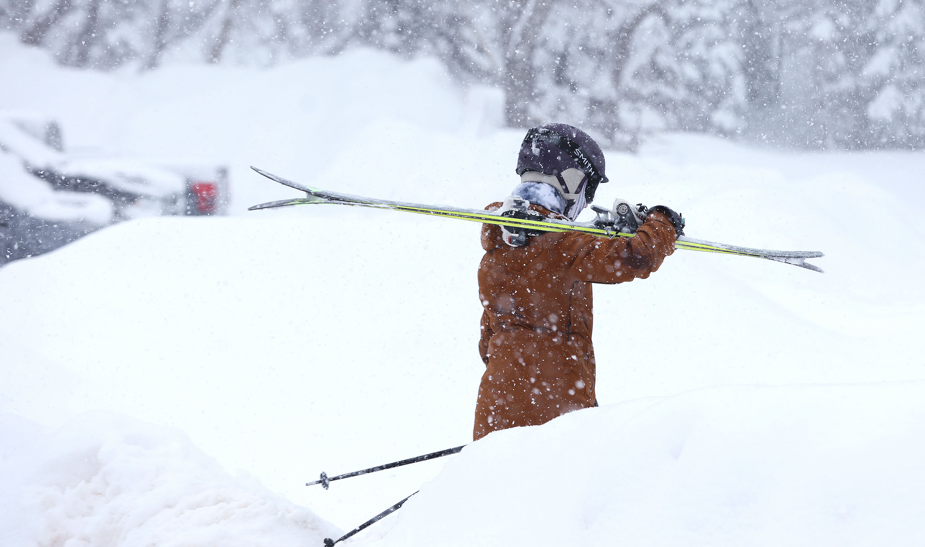 A skier walks to the lift in the newly fallen snow at Snowbird Ski Resort on Feb. 7. A storm arriving in Utah this weekend has now sparked a flurry of winter storm warnings and watches across Utah.