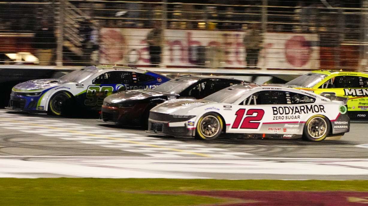 Daniel Suarez (99), left, edges out Kyle Busch (8), center, and Ryan Blaney (12) at the finish line to win during the NASCAR auto race at Atlanta Motor Speedway Sunday, Feb. 25, 2024, in Hampton, Ga.