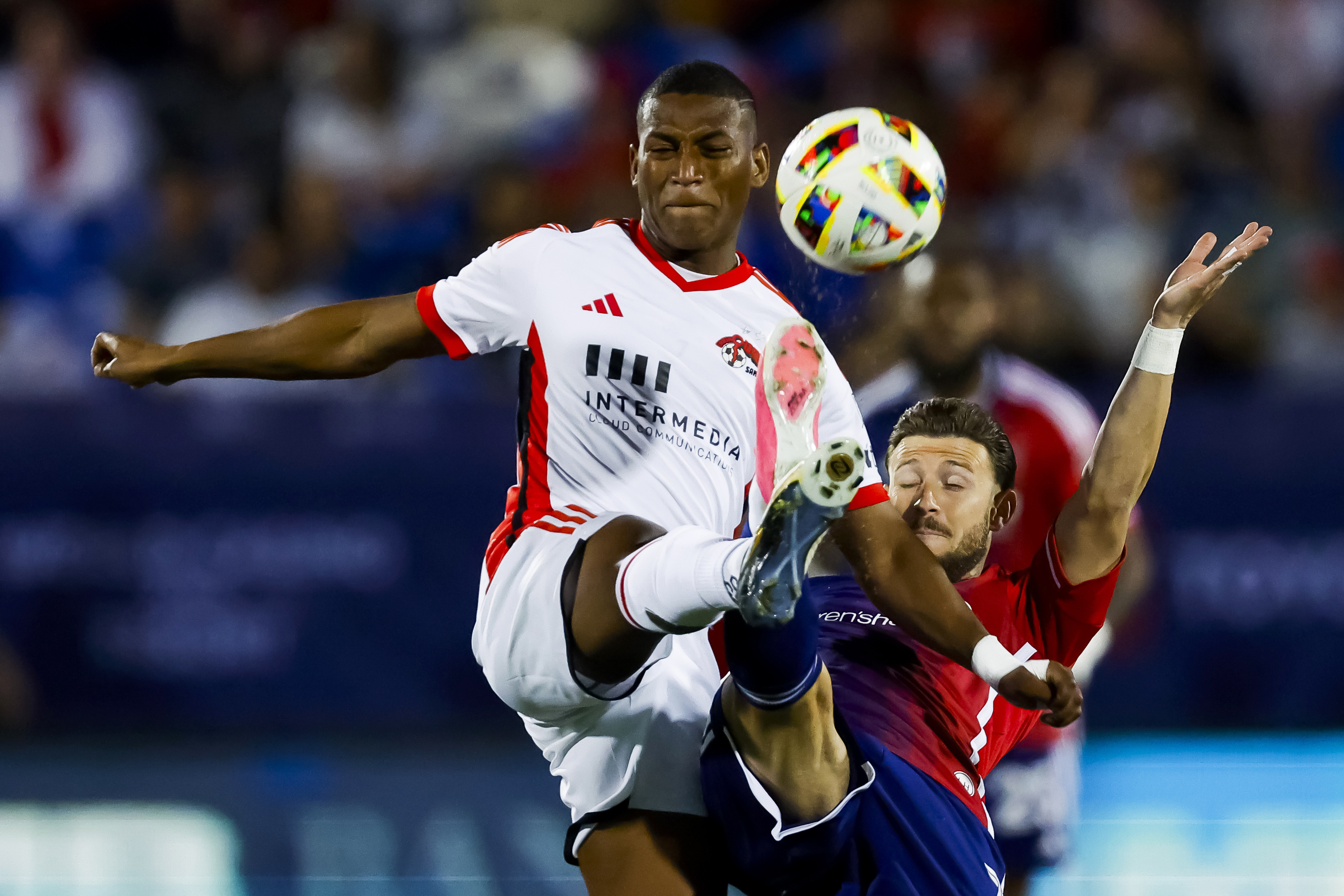 San Jose Earthquakes midfielder Carlos Gruezo, left, and FC Dallas forward Paul Arriola, right, vie for the ball during the first half of an MLS soccer match Saturday, Feb. 24, 2024, in Frisco, Texas. 