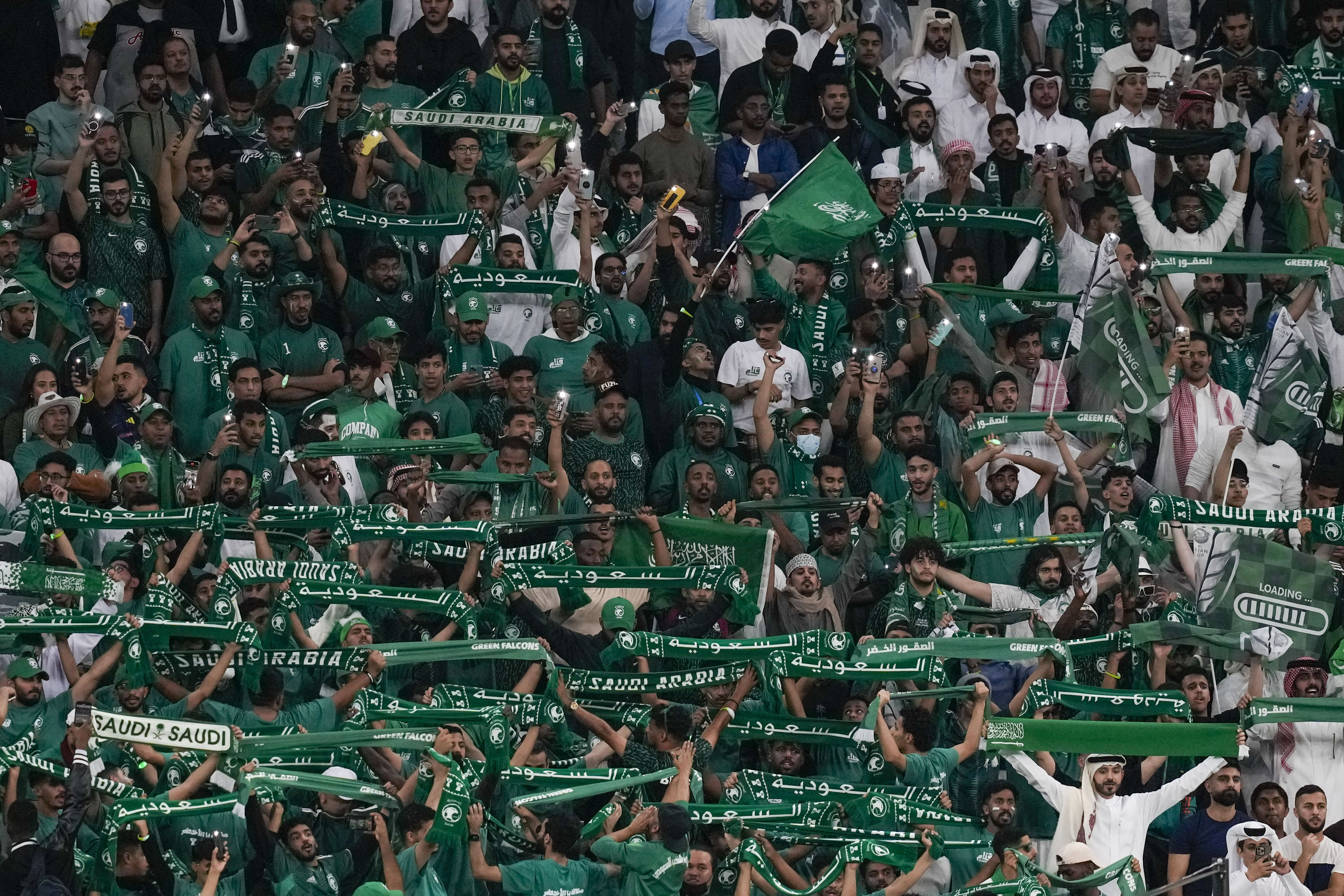 FILE - Saudi Arabia fans support their team during the Asian Cup Round of 16 soccer match between Saudi Arabia and South Korea, at the Education City Stadium in Al Rayyan, Qatar, Tuesday, Jan. 30, 2024. Saudi Arabia launched its formal bid campaign Friday, March 1, 2024, to host the 2034 World Cup, in a race that basically became a formality last October when the oil-rich kingdom was the only candidate to enter the contest. 