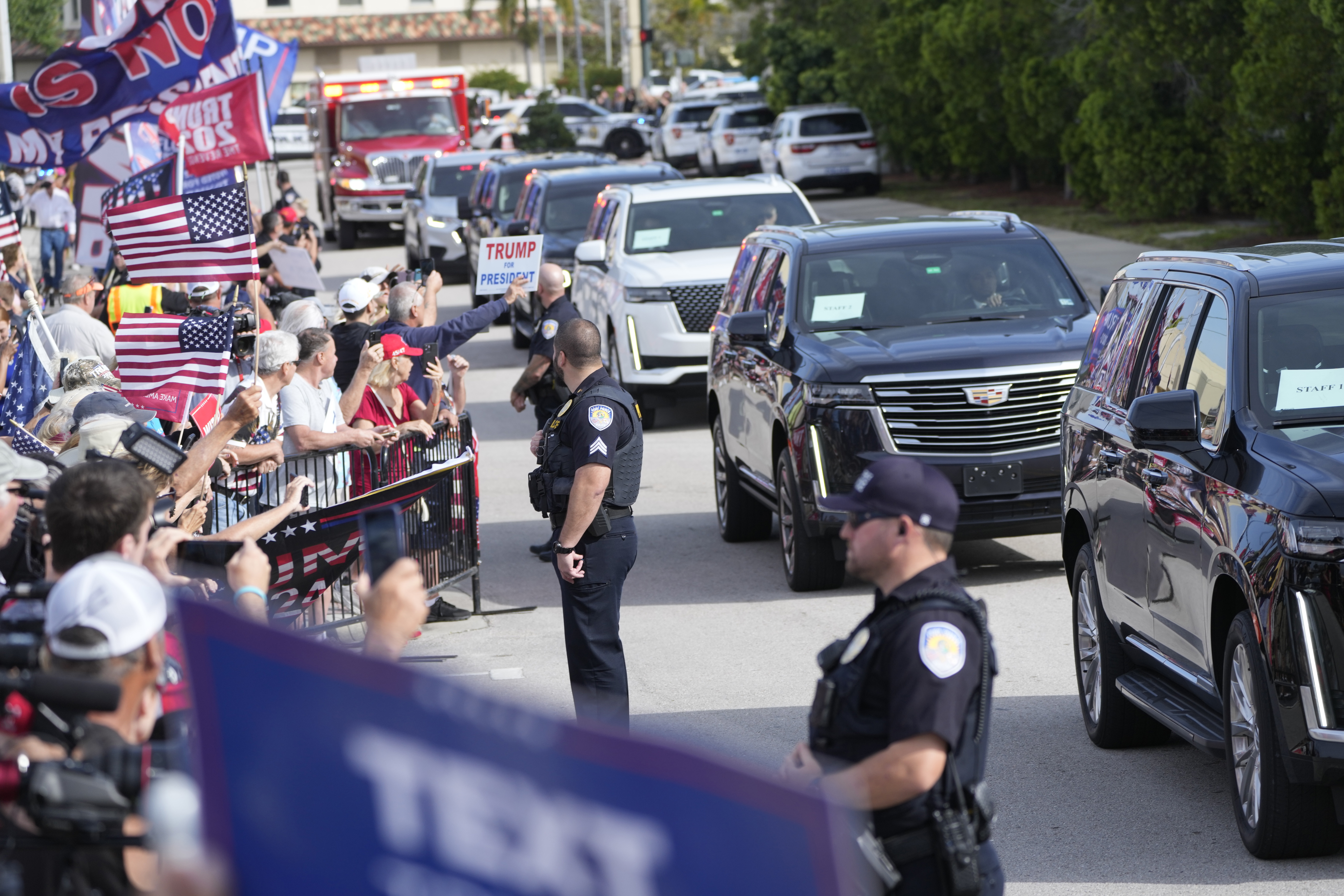 Supporters cheer as the motorcade carrying former President Donald Trump arrives at the Federal Courthouse, Friday in Fort Pierce, Fla.