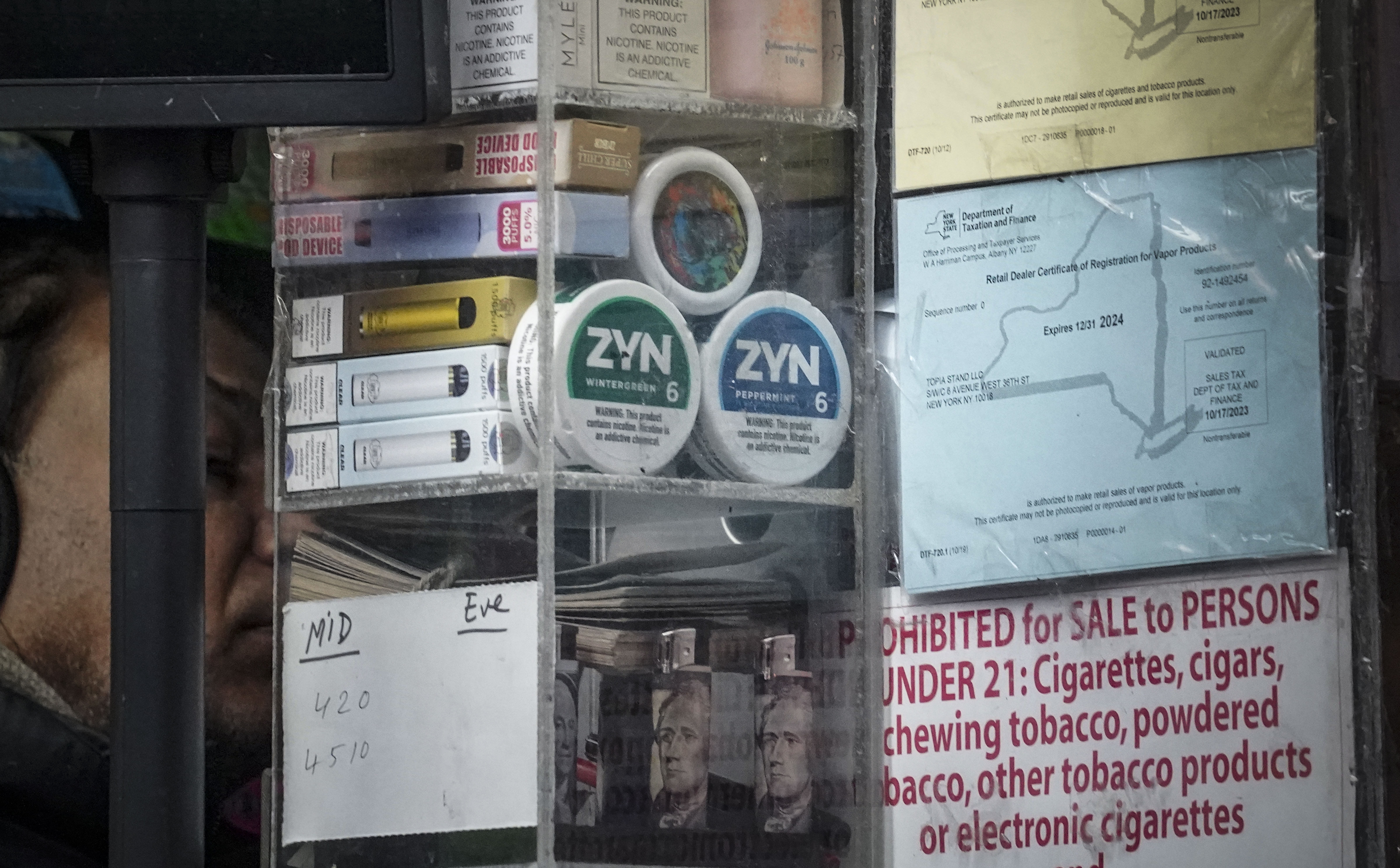 Containers of Zyn, a Phillip Morris smokeless nicotine pouch, are stacked for sale at a newsstand Feb. 23, in New York.