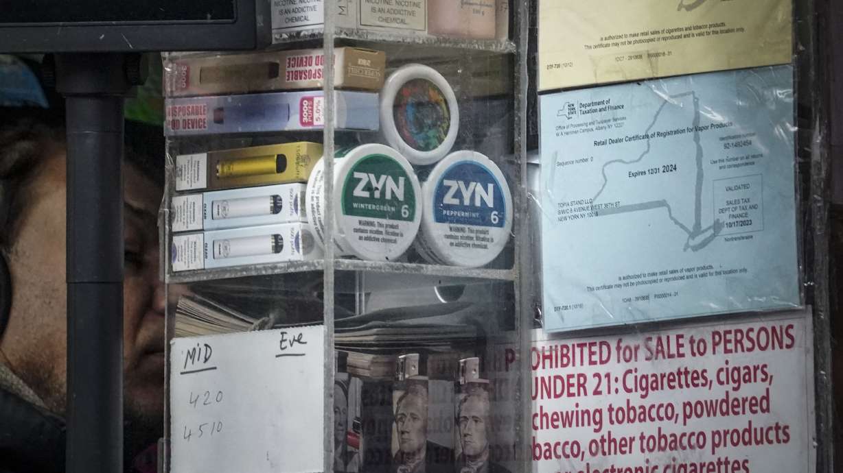 Containers of Zyn, a Phillip Morris smokeless nicotine pouch, are stacked for sale at a newsstand Feb. 23, in New York.