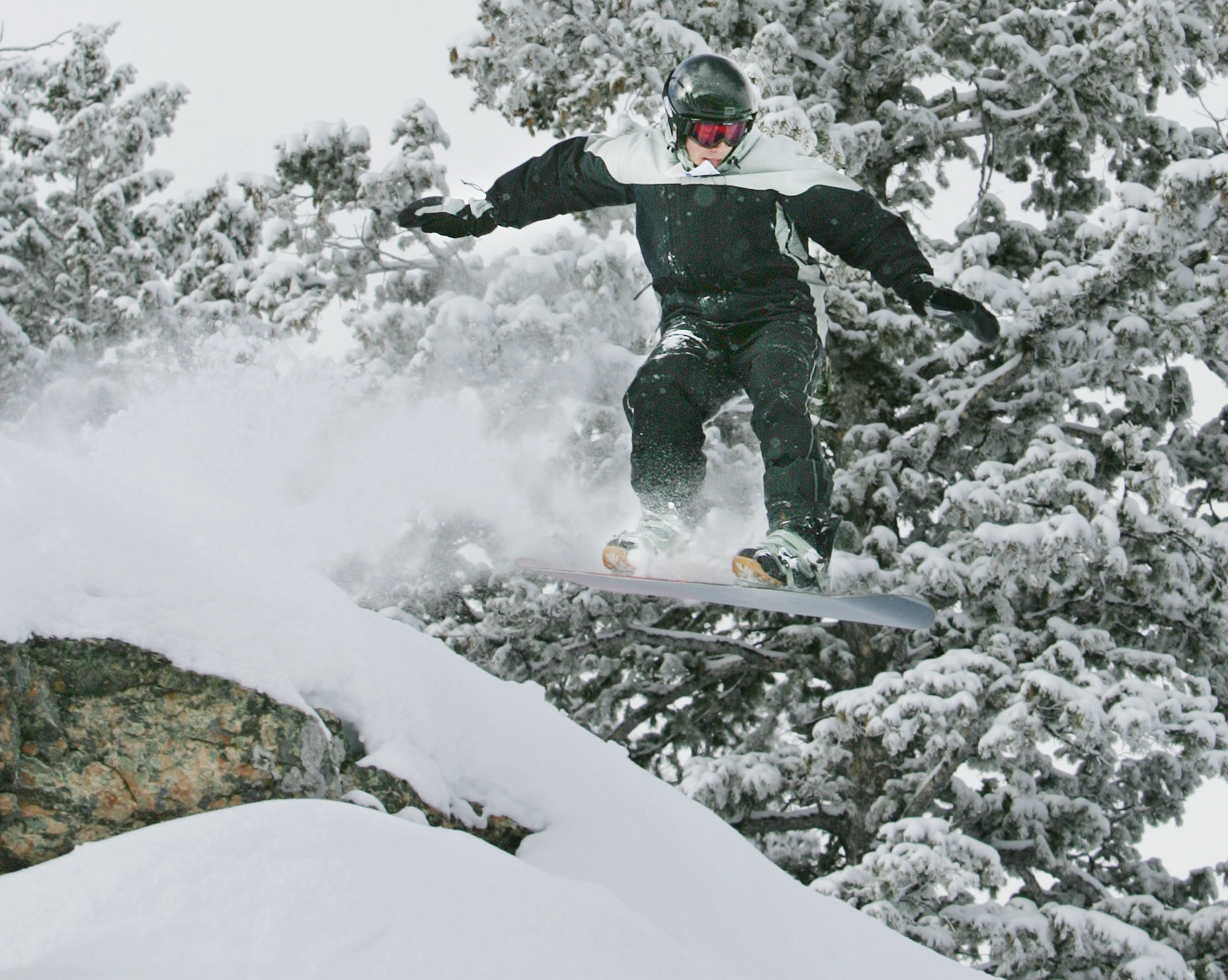 Powder Mountain ski resort in Weber County will be closed for night skiing Friday and day skiing on Saturday, due to high winds. The photo shows an unidentified snowboarder at the resort on Feb 9, 2005.