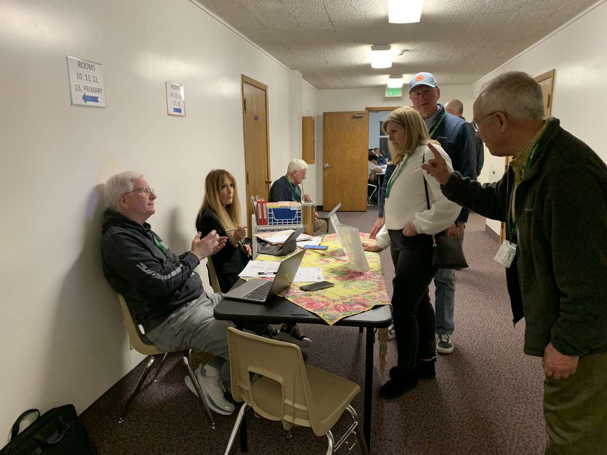 Service missionaries talk about English courses at the Provo Pioneer Park Community Resource Center on Tuesday.