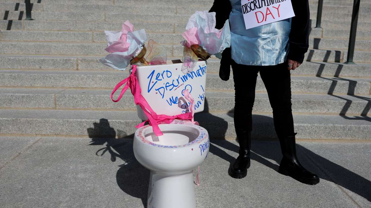 A toilet was placed on the stairs of the Capitol by members of Utah Students Unite during Zero Discrimination Day in Salt Lake City on Friday. Members of the LGBTQ community were invited to “flush their fears away” by writing messages on the toilet.