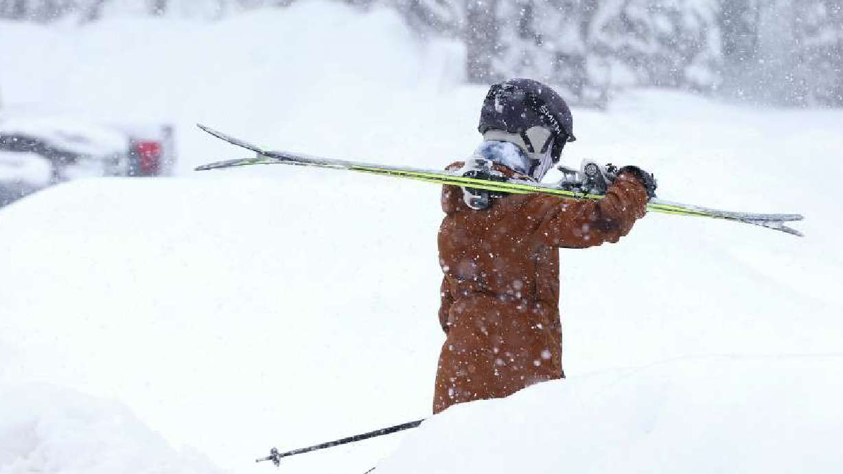 A skier walks to the lift in the newly fallen snow at Snowbird Ski Resort on Feb. 7. A storm is forecast to provide at least 1 foot of snow in Utah's mountains between Friday and Saturday.