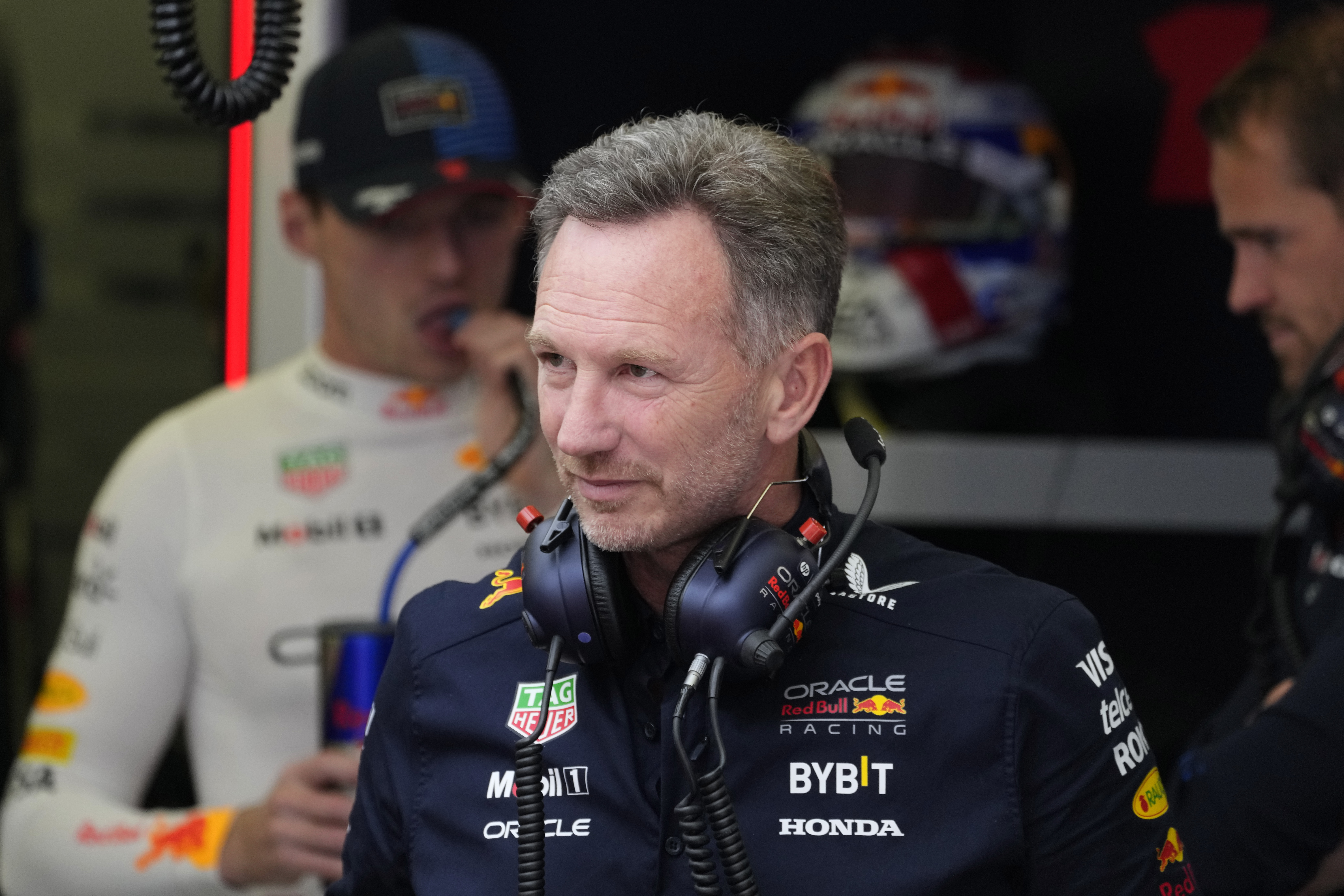 Red Bull team principal Christian Horner stands in his team garage during the third practice session ahead of the Formula One Bahrain Grand Prix at the Bahrain International Circuit in Sakhir, Bahrain, Friday, March 1, 2024.
