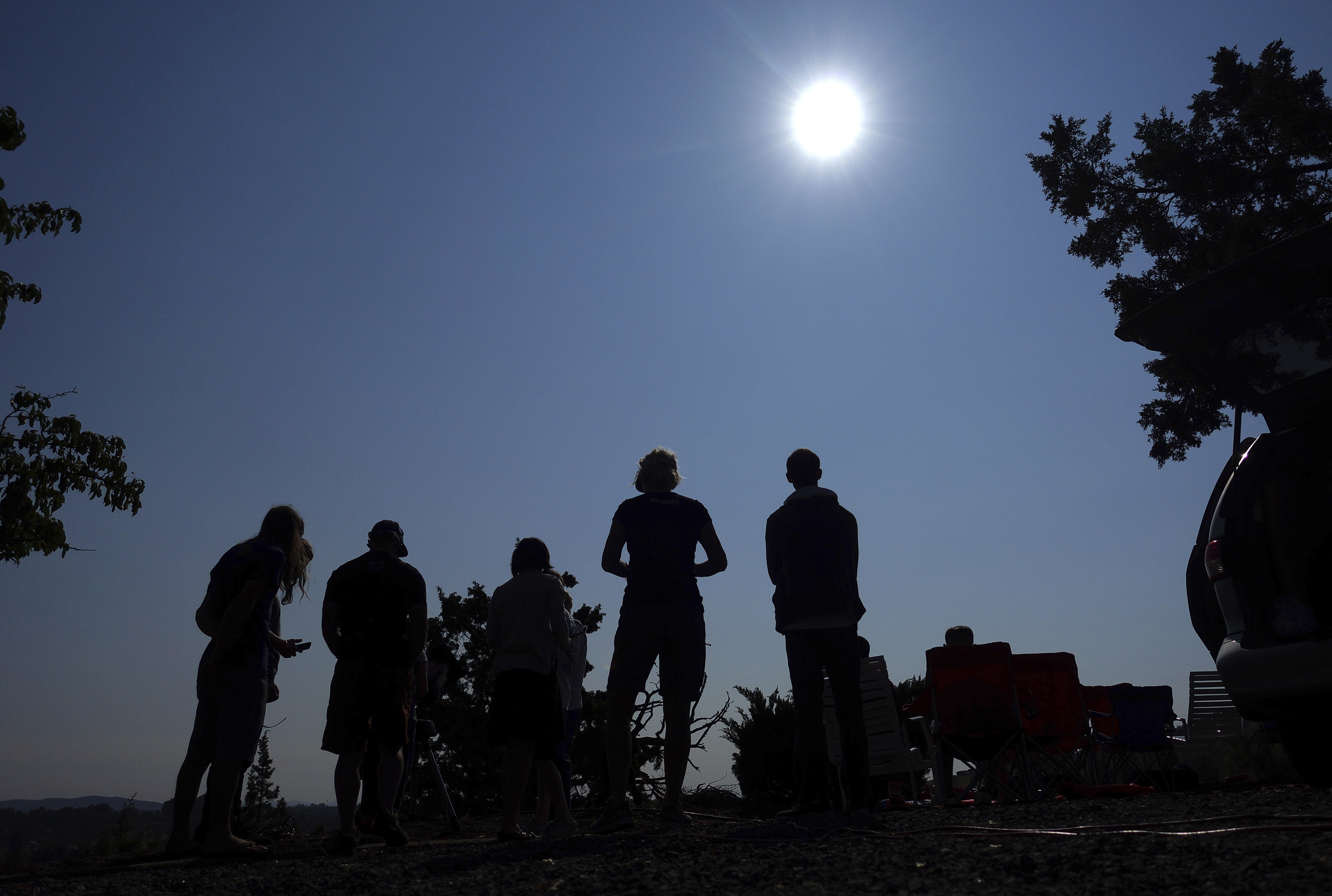 People gather near Redmond, Ore., to view the sun as it nears a total eclipse Aug. 21, 2017. The April 8 total solar eclipse in North America first hits land at Mexico’s Pacific coast, cuts across the U.S. from Texas to Maine and exits in eastern Canada.