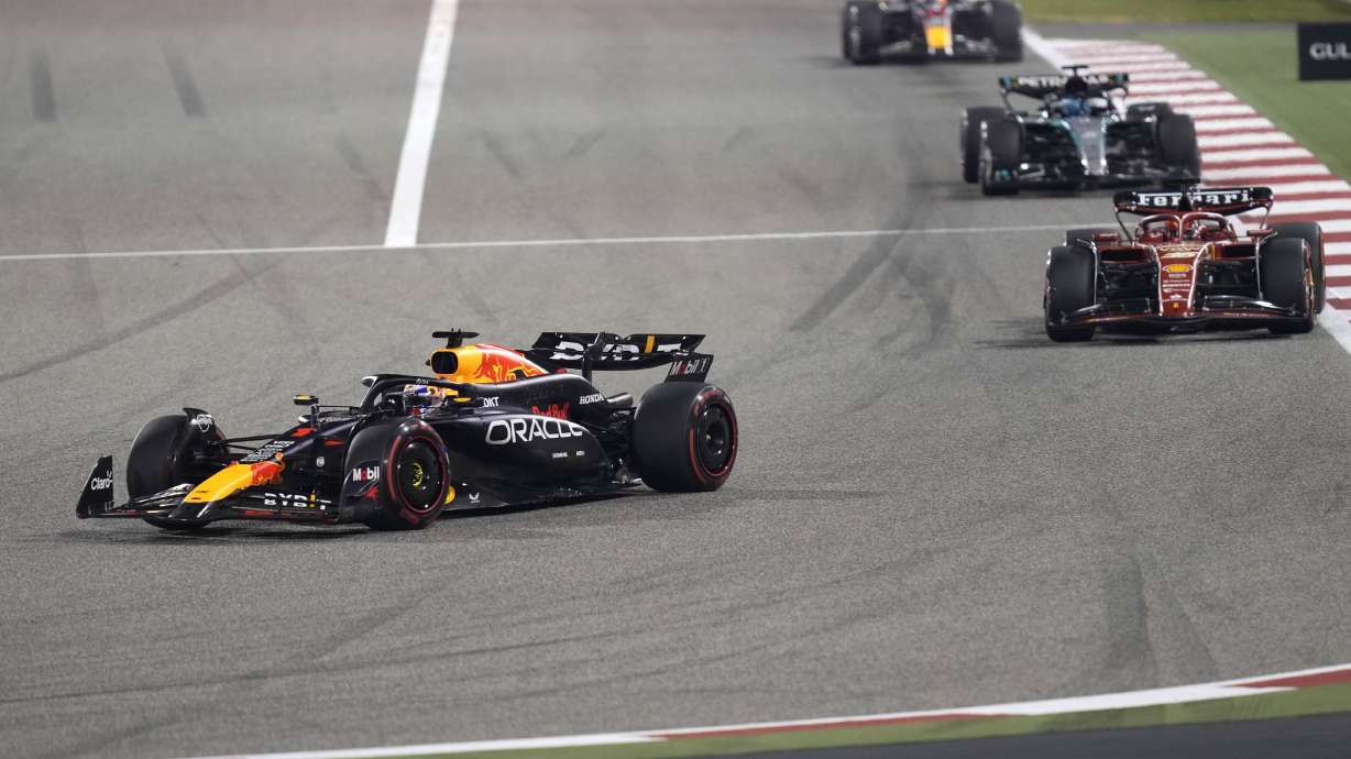 Red Bull driver Max Verstappen of the Netherlands, left, steers his car into a corner at the start of the Formula One Bahrain Grand Prix at the Bahrain International Circuit in Sakhir, Bahrain, Saturday, March 2, 2024.