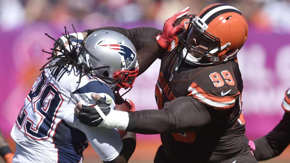 FILE - Cleveland Browns defensive tackle Stephen Paea (99) tackles New England Patriots running back LeGarrette Blount in the first half of an NFL football game Sunday, Oct. 9, 2016, in Cleveland. Paea was the top performer in the bench press at the NFL scouting combine in 2015.