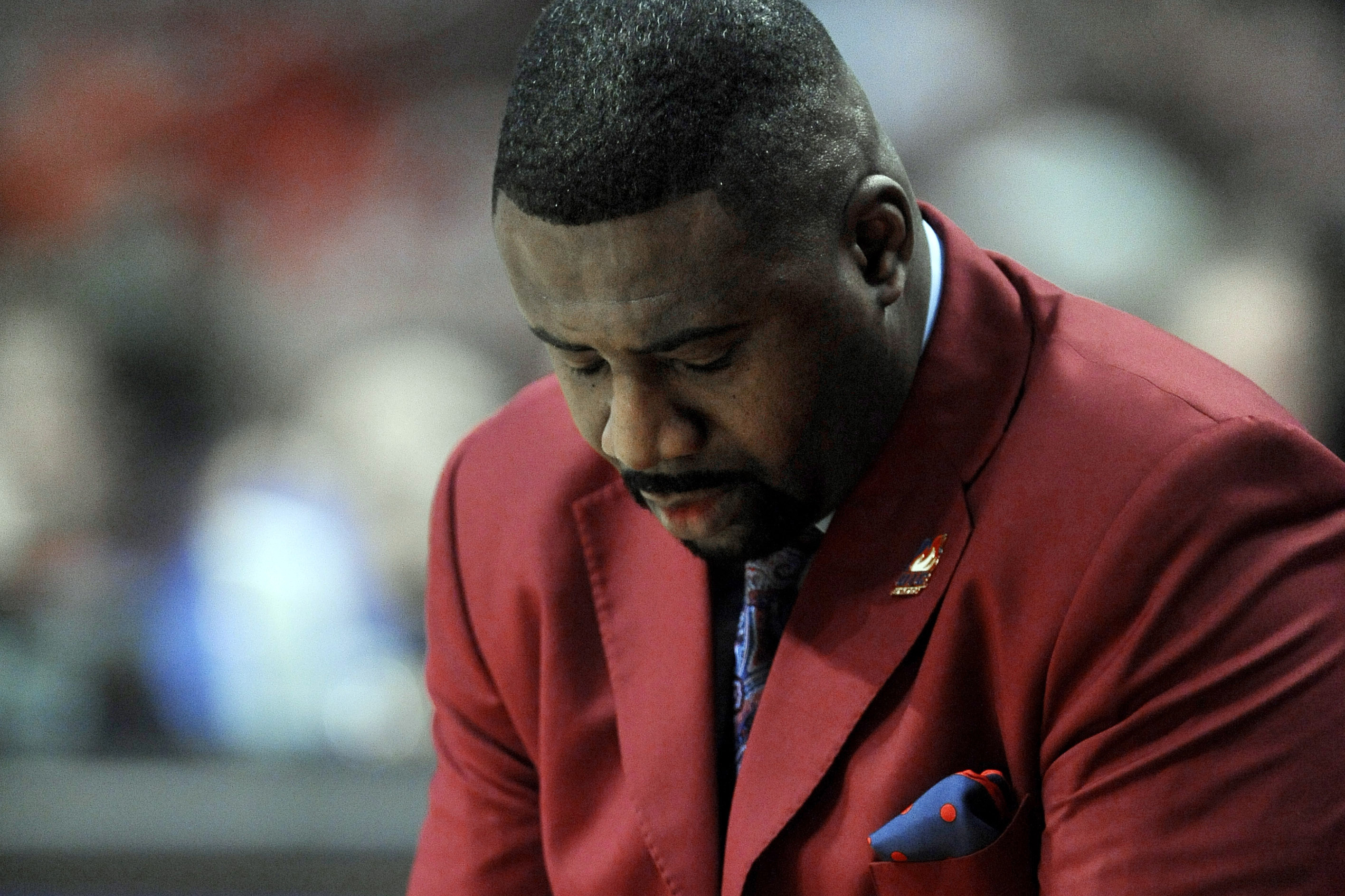 FILE - Illinois-Chicago head coach Howard Moore reacts during the final minutes of the second half of an NCAA basketball game against Illinois in Chicago, Saturday, Dec. 28, 2013. He played for Wisconsin from 1993-95 and was an assistant coach with the Badgers from 2006-10 and 2016-19. Moore also was Illinois-Chicago’s head coach from 2010-15. Moore received a standing ovation Saturday, March 2, 2024, in his first public appearance at the Kohl Center since a 2019 car wreck that killed his wife and daughter and left him with serious injuries. 