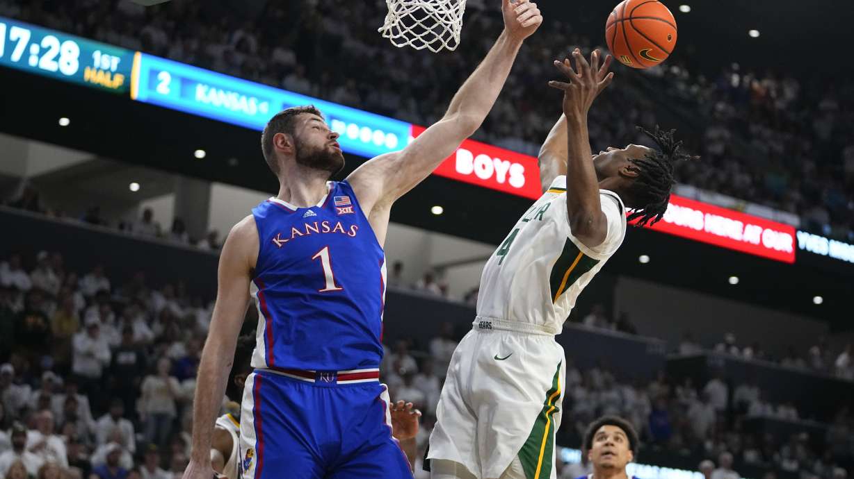 Kansas's Hunter Dickinson (1) blocks a shot by Baylor's Ja'Kobe Walter (4) during the first half of an NCAA college basketball game, Saturday, March 2, 2024, in Waco, Texas.