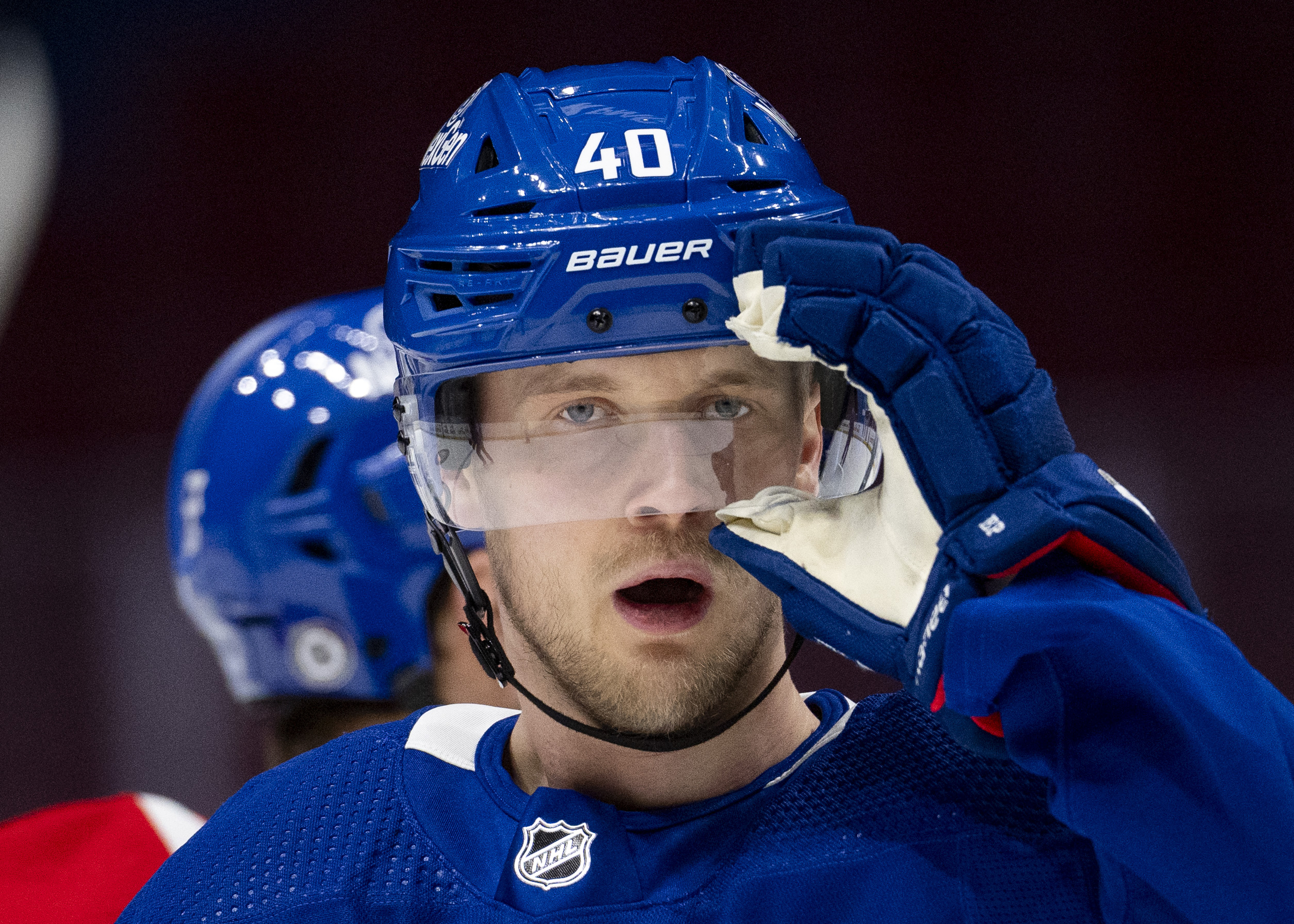 Vancouver Canucks' Elias Pettersson adjusts his helmet during an NHL hockey practice in Vancouver, British Columbia on Saturday, March 2, 2024. Pettersson resigned to the team with an eight year contract extension. 