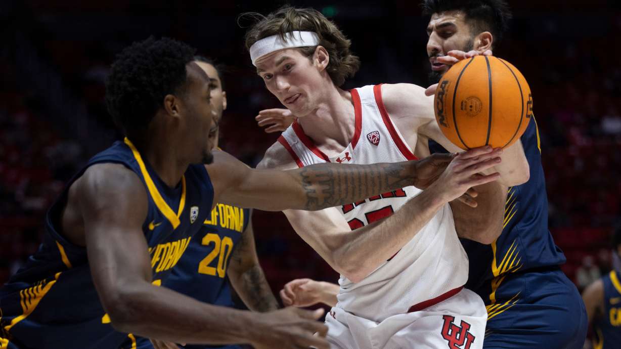 Utah Utes center Branden Carlson (35) fights for the ball against California Golden Bears guard Jalen Celestine (32) and California Golden Bears forward Fardaws Aimaq (00) during a game at the Huntsman Center in Salt Lake City on Saturday, March 2, 2024.