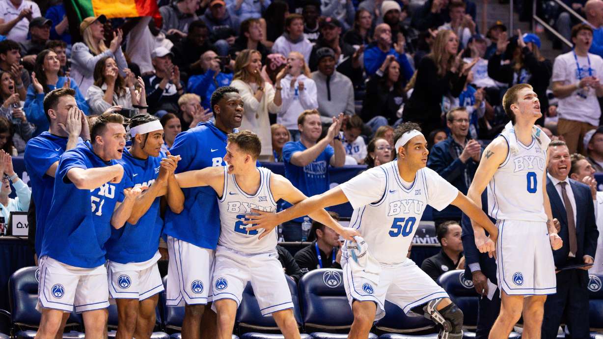 Brigham Young Cougars players react excitedly from the bench during the second half of the college men’s basketball game between the Brigham Young Cougars and the TCU Horned Frogs at the Marriott Center in Provo on Saturday, March 2, 2024.