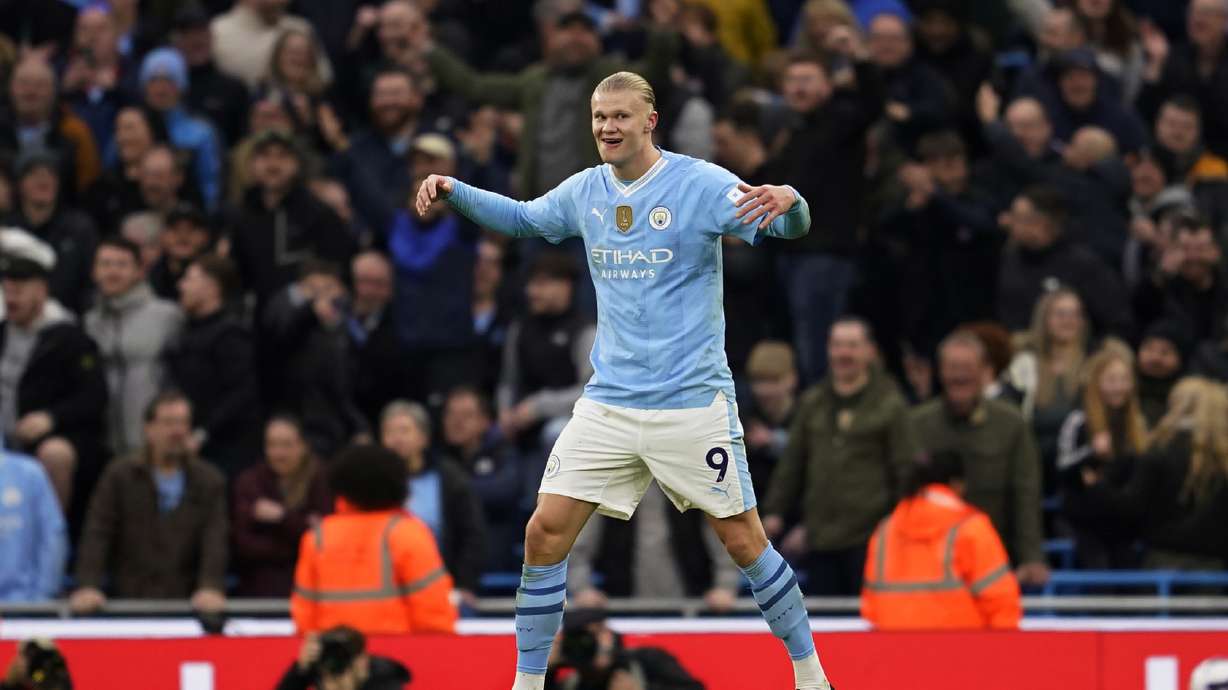 Manchester City's Erling Haaland celebrates after scoring his side's third goal during an English Premier League soccer match between Manchester City and Manchester United at the Etihad Stadium in Manchester, England, Sunday, March 3, 2024.