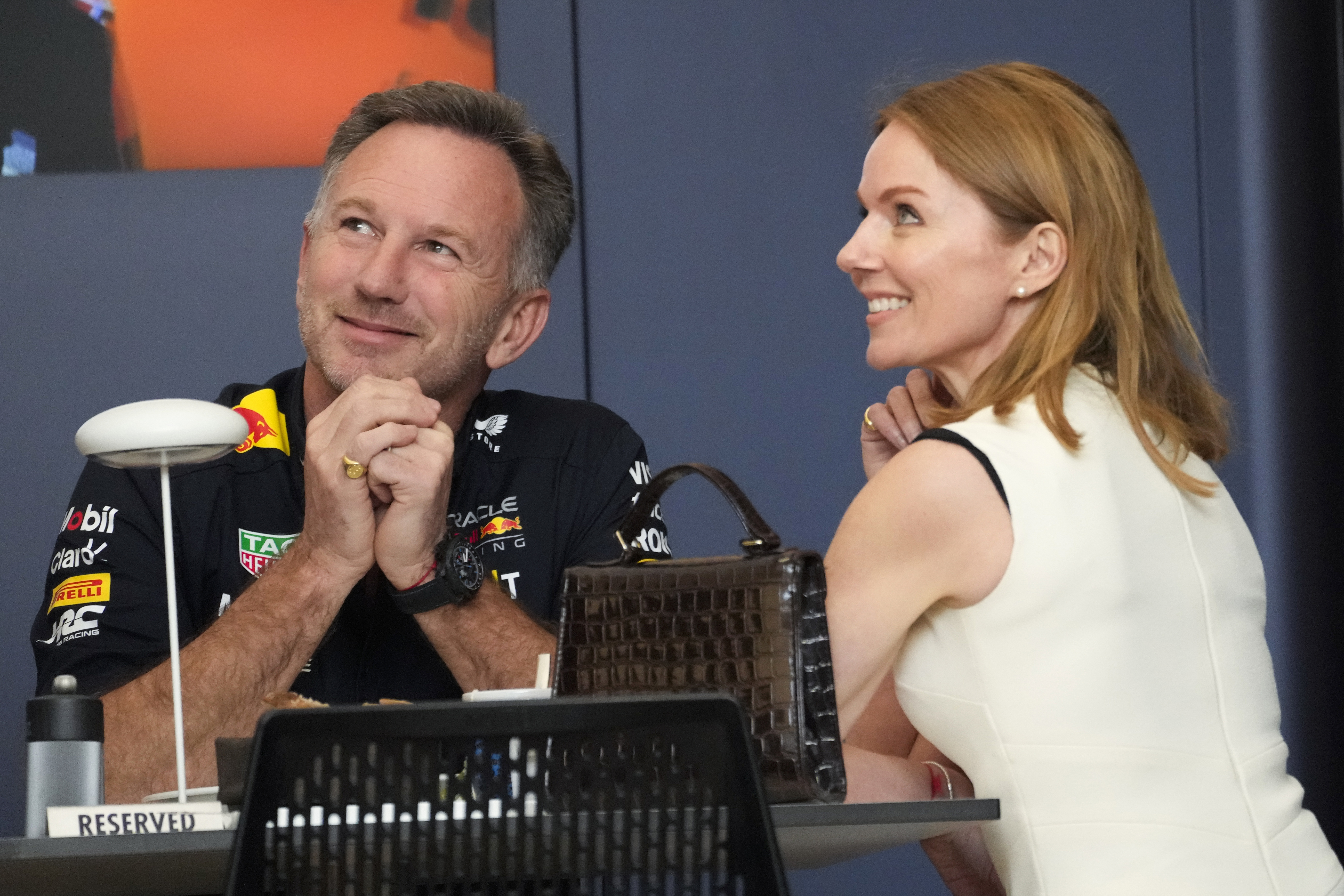 Red Bull team principal Christian Horner, left, speaks with his wife Geri Halliwell prior to the Formula One Bahrain Grand Prix at the Bahrain International Circuit in Sakhir, Bahrain, Saturday, March 2, 2024. 