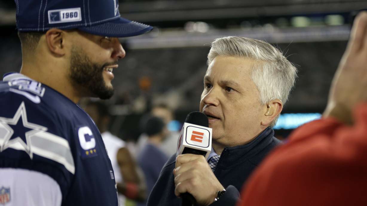 FILE - ESPN reporter Chris Mortensen, right, interviews Dallas Cowboys quarterback Dak Prescott, left, after an NFL football game against the New York Giants, Nov. 5, 2019, in East Rutherford, N.J. Mortensen, the award-winning journalist who covered for the NFL for 39 years, including 32 as a senior analyst at ESPN, has died. He was 72. ESPN confirmed Mortensen’s death on Sunday, March 3, 2024.
