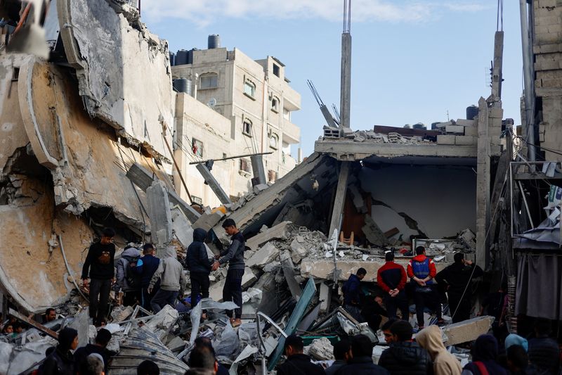 Palestinians gather at the site of an Israeli strike, amid the ongoing conflict between Israel and Hamas, in Rafah, in the southern Gaza Strip on Monday.