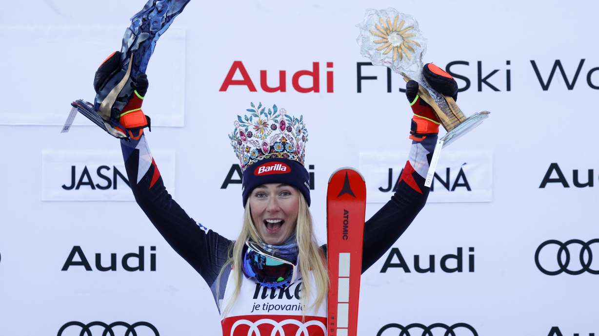 FILE - United States' Mikaela Shiffrin celebrates on the podium after winning an alpine ski, women's World Cup slalom race, in Jasna, Slovakia, Sunday, Jan. 21, 2024. Mikaela Shiffrin’s return from her downhill crash is still on schedule for this weekend in Åre.
