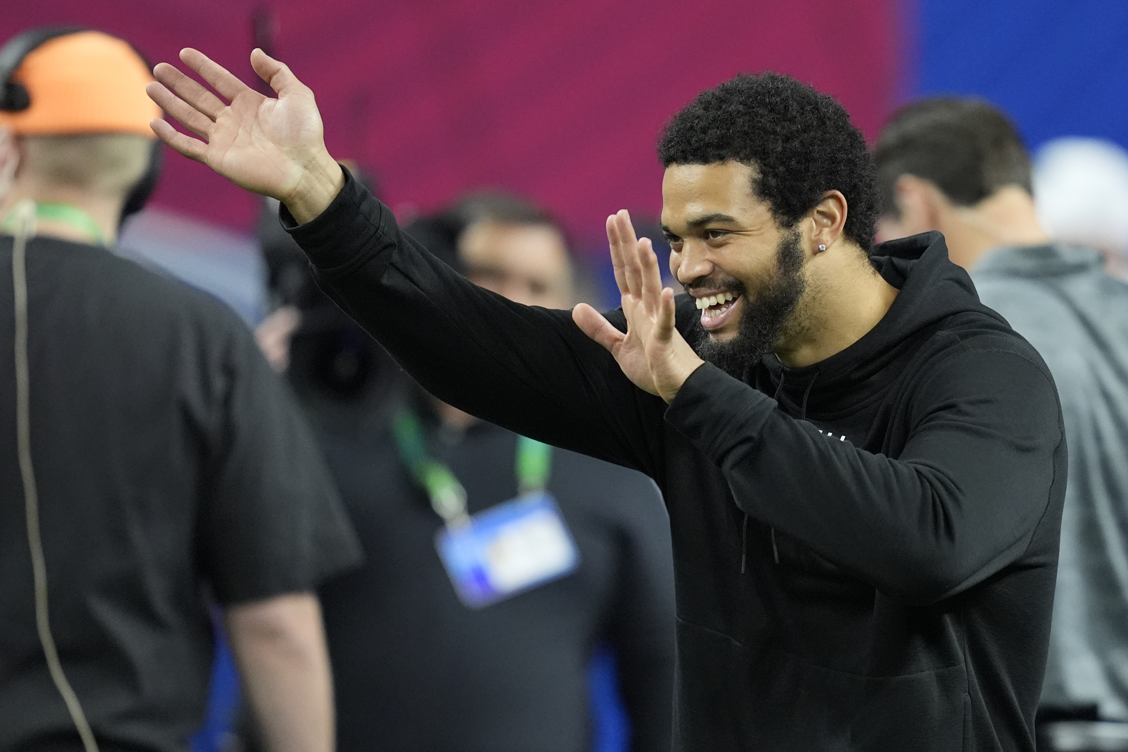 Southern California quarterback Caleb Williams watches as players run a drill at the NFL football scouting combine, Saturday, March 2, 2024, in Indianapolis. 