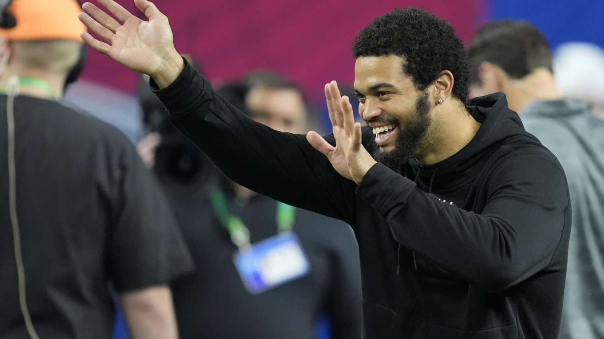 Southern California quarterback Caleb Williams watches as players run a drill at the NFL football scouting combine, Saturday, March 2, 2024, in Indianapolis.