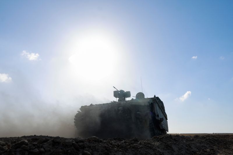 A military vehicle maneuvers near the Israel-Gaza border, amid the ongoing conflict between Israel and the Palestinian Islamist group Hamas, in Israel, Monday.