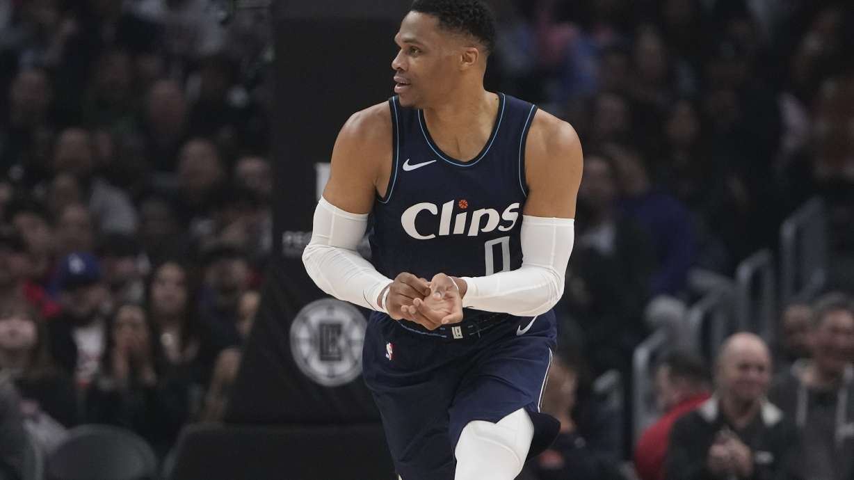Los Angeles Clippers guard Russell Westbrook runs up the court during the first half of the team's NBA basketball game against the Washington Wizards, Friday, March 1, 2024, in Los Angeles. Westbrook fractured his left hand during the first half.