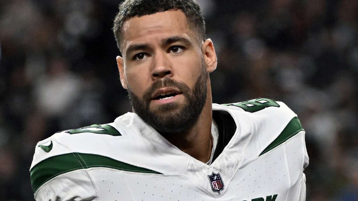 FILE - New York Jets tight end C.J. Uzomah (87) looks on before the start of an NFL football game against the Las Vegas Raiders Sunday, Nov. 12, 2023, in Las Vegas. The New York Jets plan to release veteran tight end C.J. Uzomah, according to a person with knowledge of the decision. The person spoke to The Associated Press on condition of anonymity Tuesday, March 5, 2024, because the Jets had not yet announced the move.