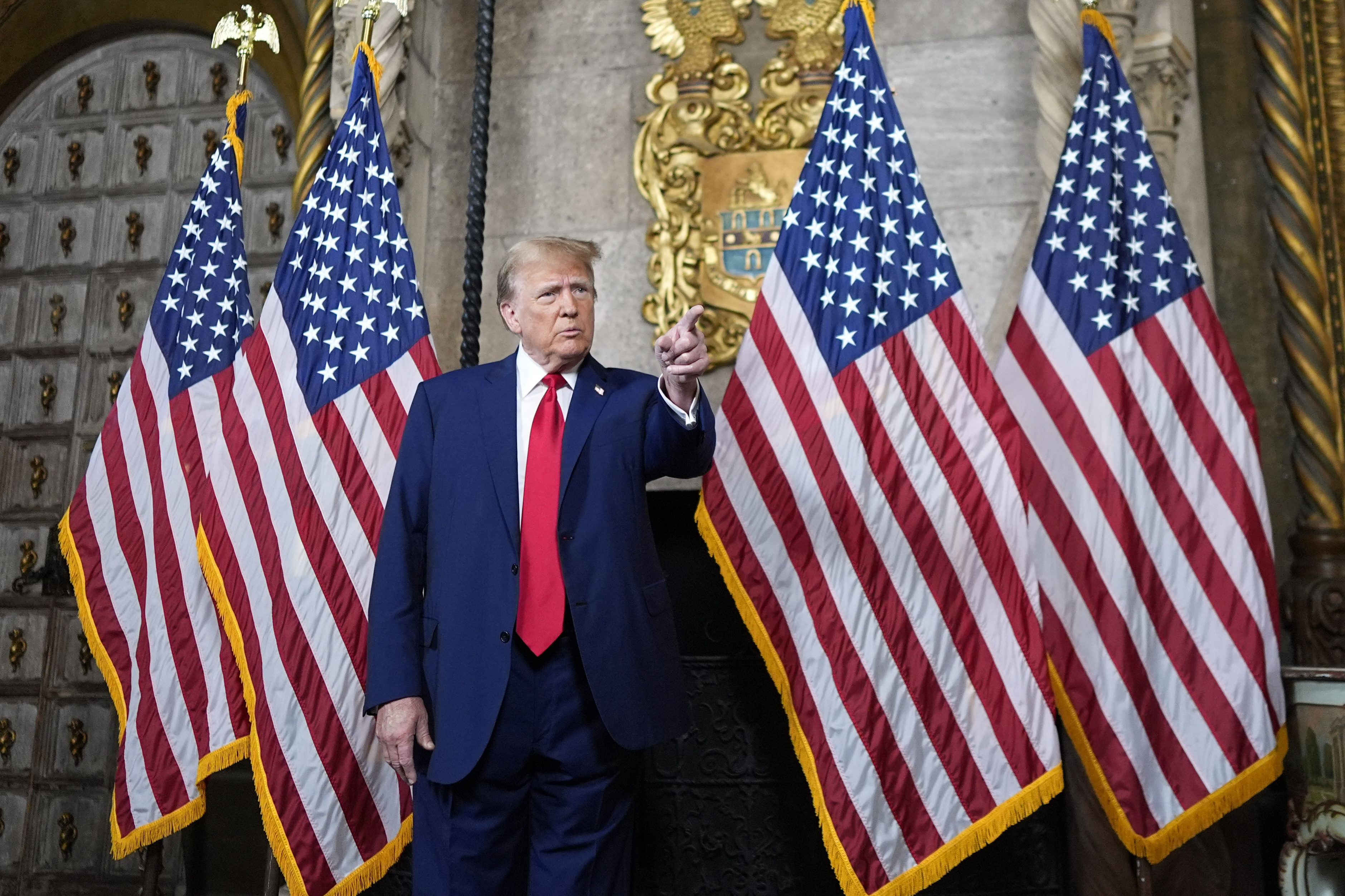 Republican presidential candidate former President Donald Trump points to a reporter for a question as he speaks at his Mar-a-Lago estate, Monday, in Palm Beach, Fla.