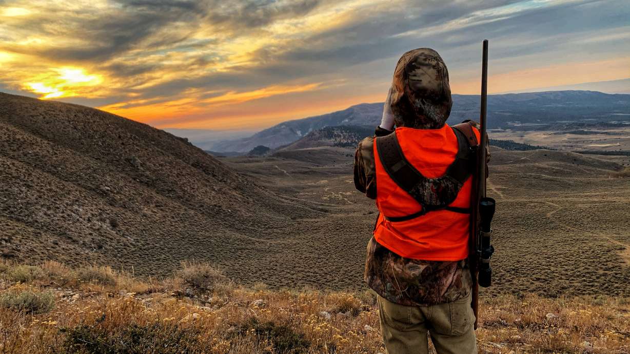 A hunter looks across a valley northwest of Vernal, just outside of the Ashley National Forest on Oct. 19, 2020. Utah lawmakers passed two bills with hunting changes this year, including new regulations tied to wearing orange.