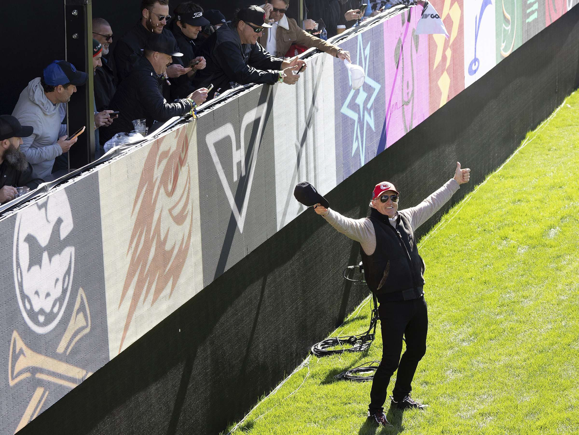 LIV Golf CEO Greg Norman, bottom, reacts on the eighth hole during the final round of LIV Golf Las Vegas at Las Vegas Country Club, Saturday, Feb. 10, 2024, in Las Vegas. 