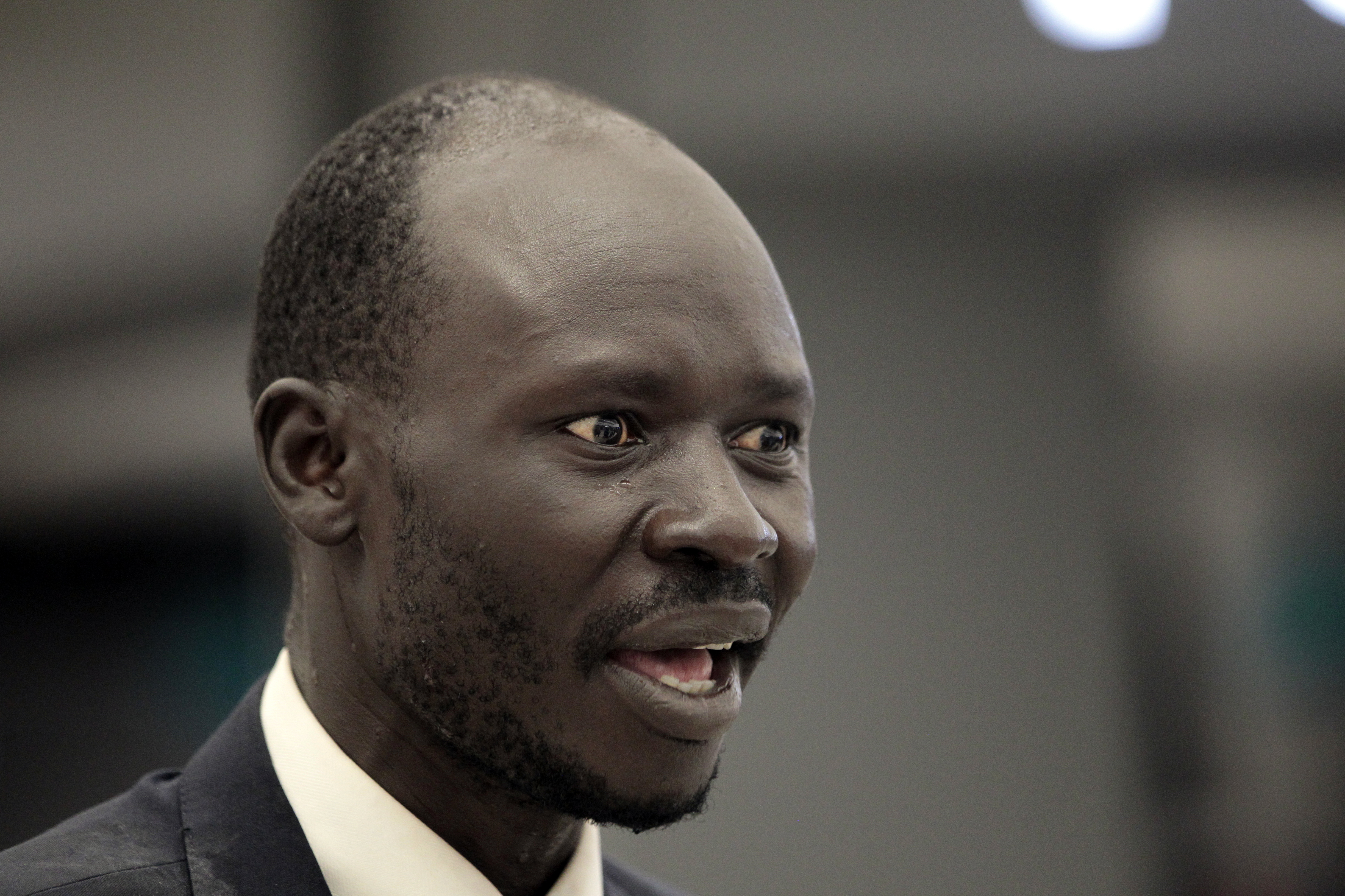 Peter Biar Ajak arrives at Washington Dulles International Airport, July 23, 2020, in Chantilly, Va. Ajak, a leading South Sudanese academic and activist living in exile in the United States, has been charged in Arizona along with a Utah man born in the African nation on charges of conspiring to buy and illegally export millions of dollars’ worth of weapons.