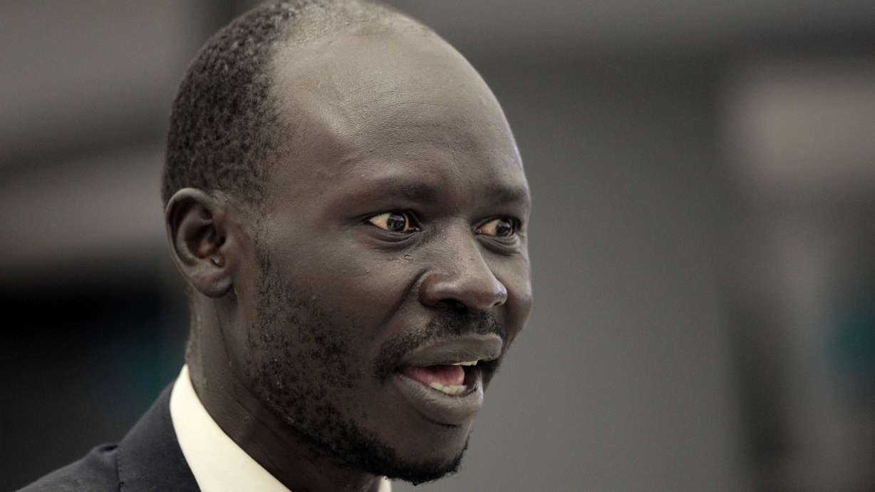 Peter Biar Ajak arrives at Washington Dulles International Airport, July 23, 2020, in Chantilly, Va. Ajak, a leading South Sudanese academic and activist living in exile in the United States, has been charged in Arizona along with a Utah man born in the African nation on charges of conspiring to buy and illegally export millions of dollars’ worth of weapons.