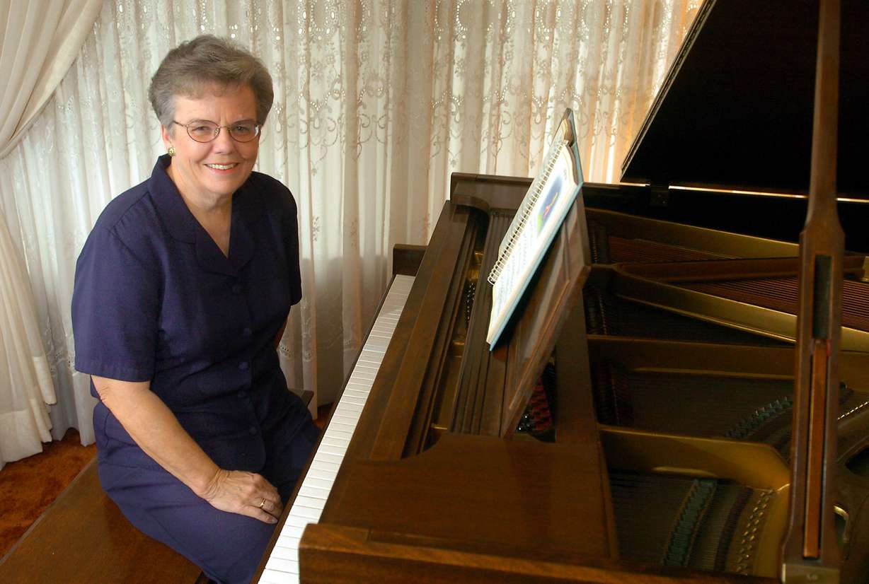 Songwriter Janice Kapp Perry sits at her piano in her Provo home on Oct. 20, 2004.