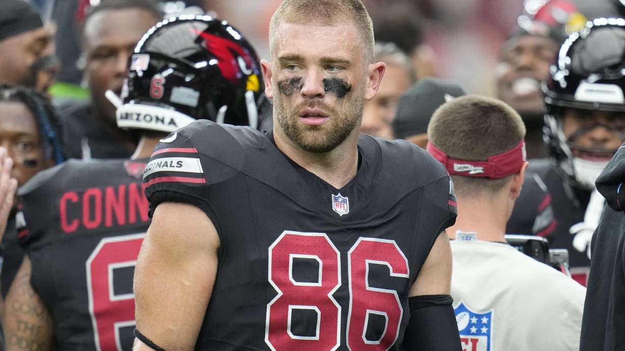 FILE - Arizona Cardinals tight end Zach Ertz pauses on the field prior to an NFL football game against the Cincinnati Bengals Sunday, Oct. 8, 2023, in Glendale, Ariz. he Washington Commanders are signing veteran tight end Ertz, two people with knowledge of the move told The Associated Press on Wednesday, March 6, 2024.